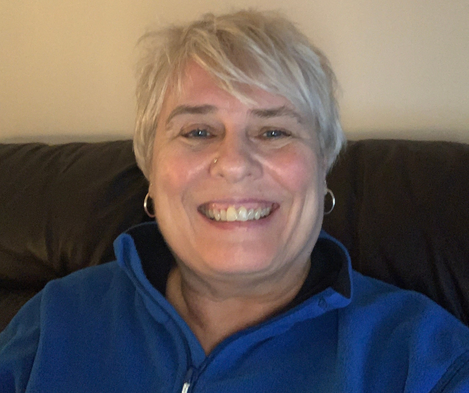 Lady wearing blue fleece smiling
